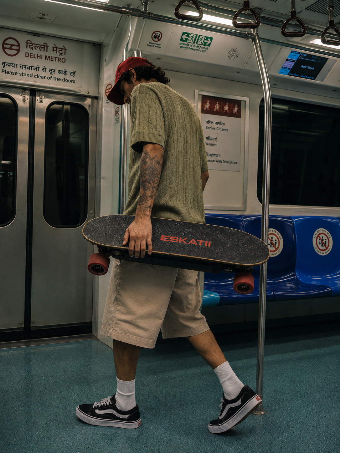 ESKATII rider carrying the skateboard inside a metro